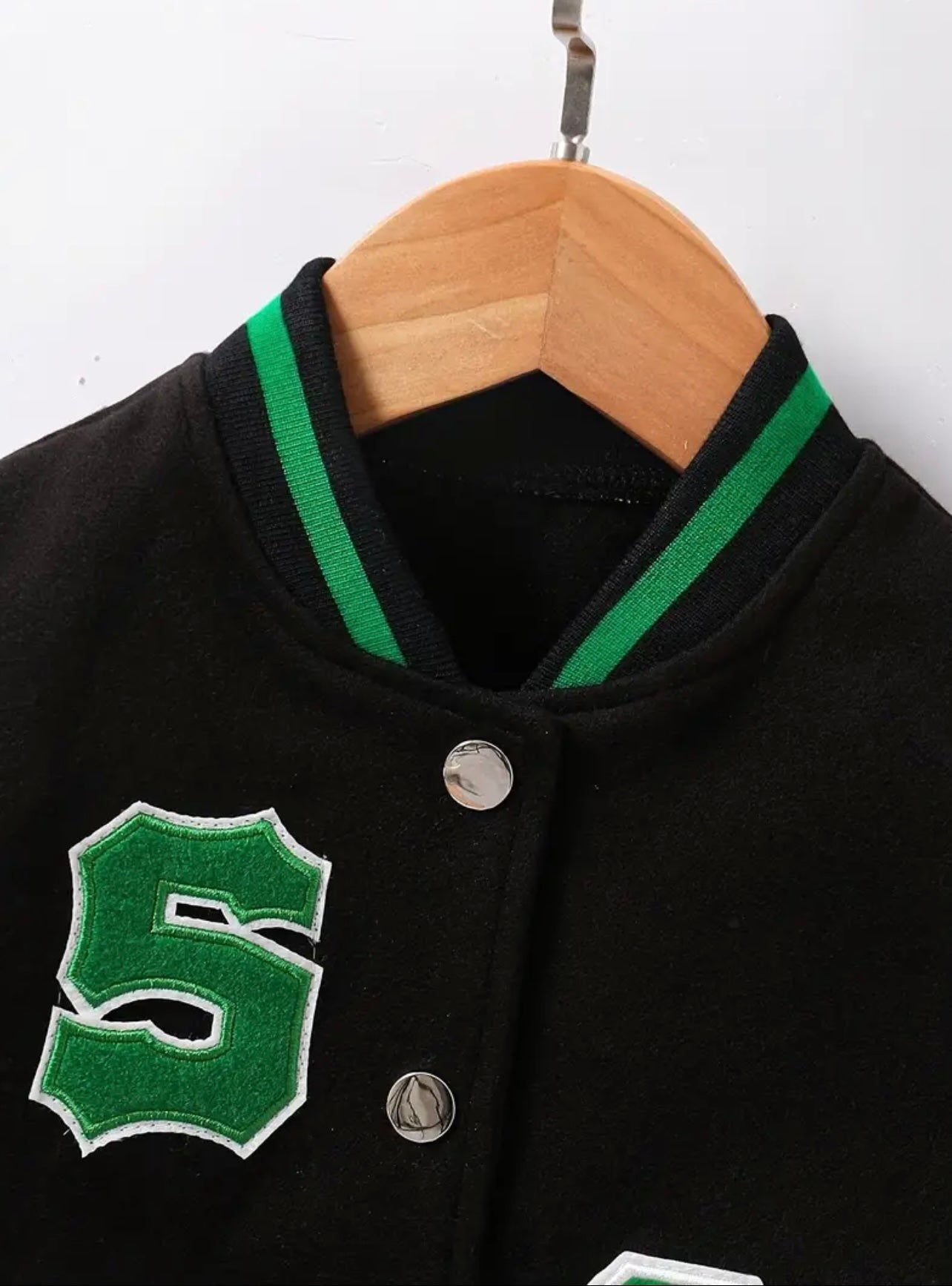 Jacket for boys 2-3 years old made of black artificial leather with green letter